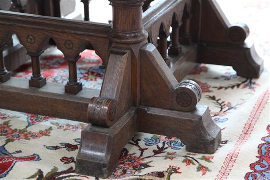 A Victorian gothic revival oak centre table, designed by Collier & Plucknett, Warwick, W.5ft D.5ft H.2ft 7in.